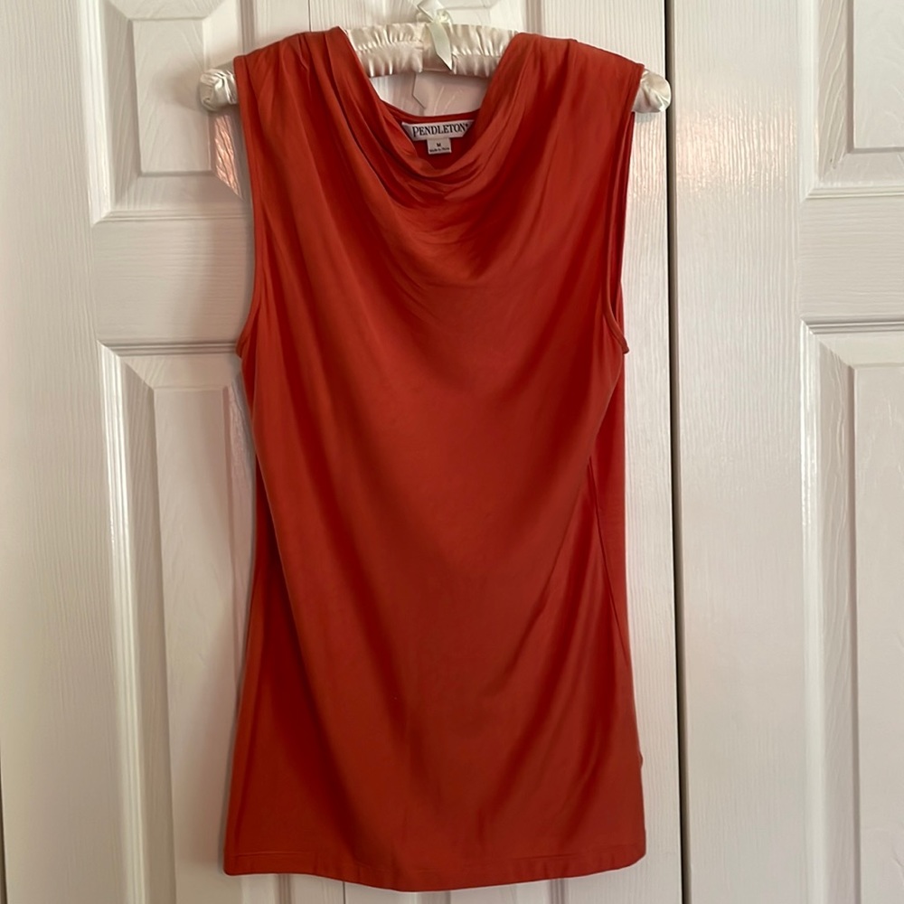 Sleeveless cowl neck top.